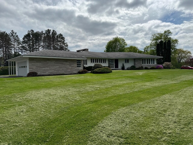 02 Rogers St, Houlton, ME 04730 - rear view of property with stone siding, an attached garage, and a yard