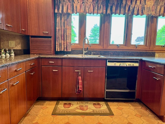 02 Rogers St, Houlton, ME 04730 - kitchen with black dishwasher, a sink, and dark stone counters
