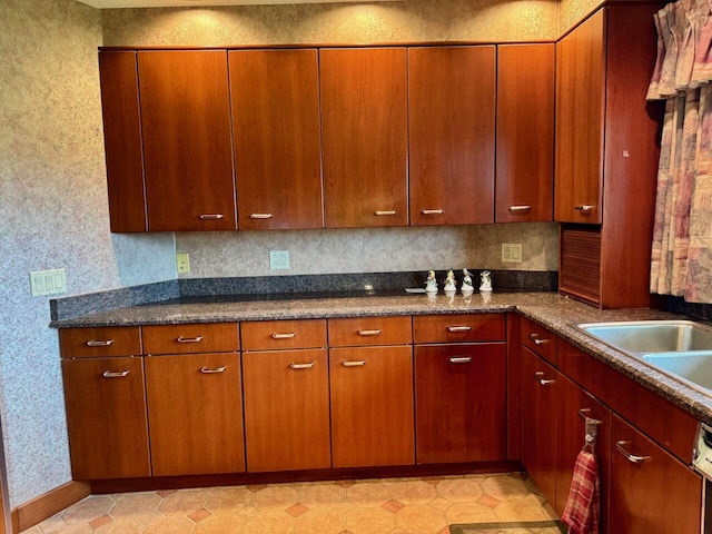 02 Rogers St, Houlton, ME 04730 - kitchen with wallpapered walls, a sink, and brown cabinetry