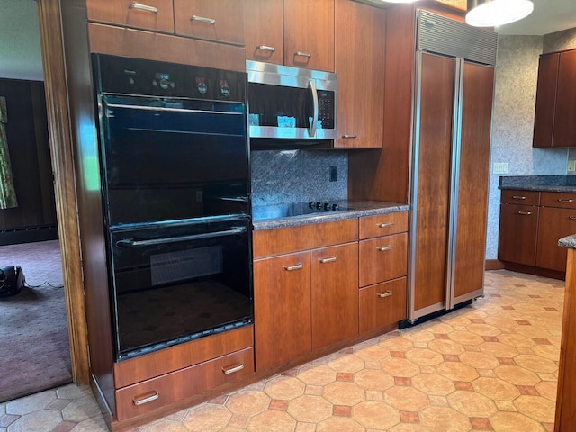 02 Rogers St, Houlton, ME 04730 - kitchen with black appliances, brown cabinetry, and light floors