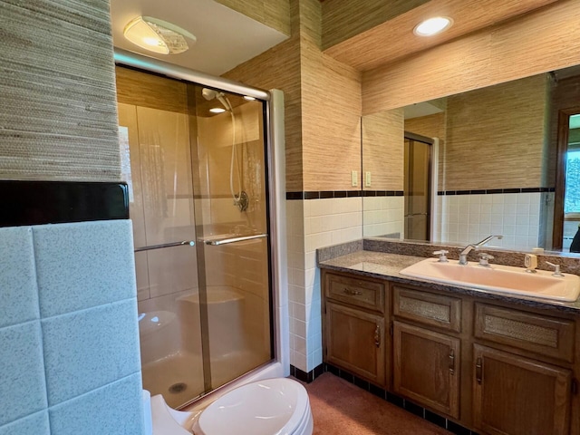 02 Rogers St, Houlton, ME 04730 - full bathroom featuring tile walls, toilet, vanity, and a stall shower
