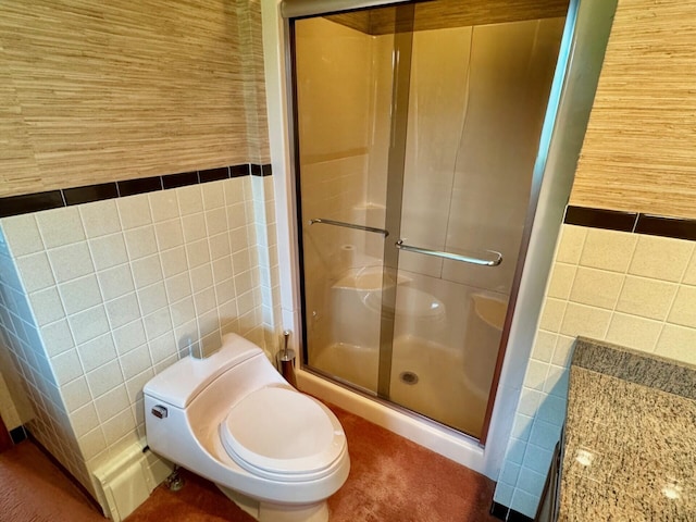 02 Rogers St, Houlton, ME 04730 - bathroom with tile walls, a shower stall, and toilet