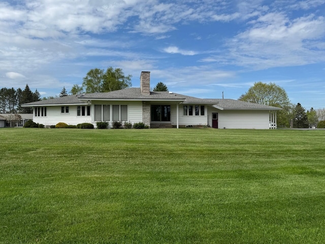 02 Rogers St, Houlton, ME 04730 - back of house featuring a chimney and a yard