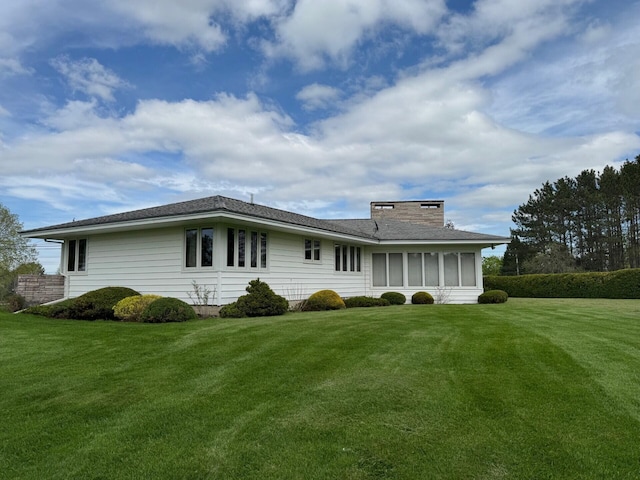 02 Rogers St, Houlton, ME 04730 - rear view of house with a lawn and a chimney