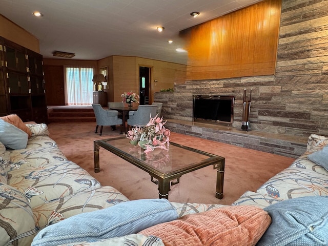 02 Rogers St, Houlton, ME 04730 - carpeted living room featuring a fireplace, recessed lighting, and wooden walls