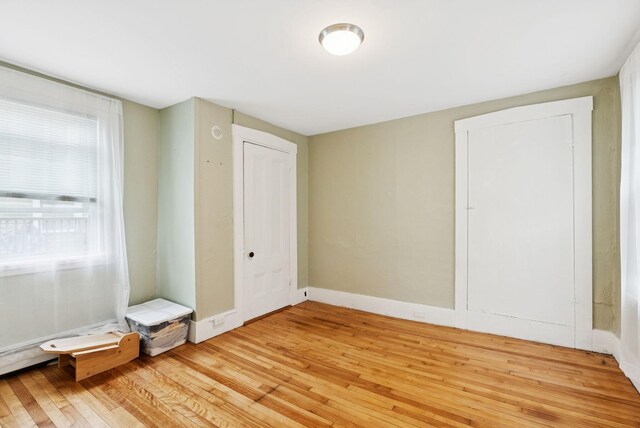 82 Winter St, Portland, ME 04102 - unfurnished bedroom featuring light wood-style floors and baseboards
