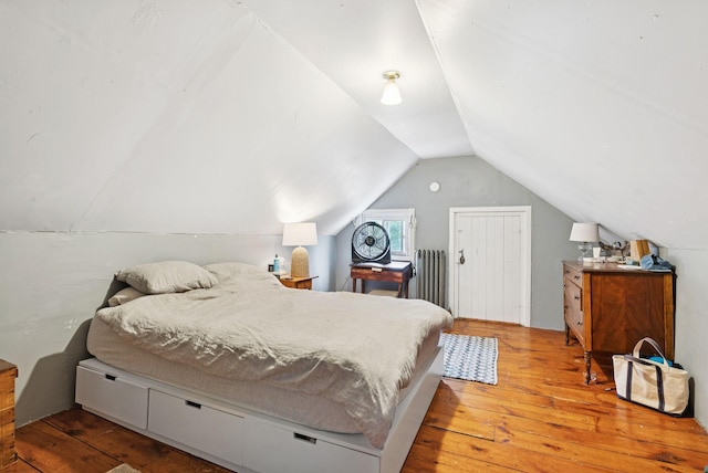 82 Winter St, Portland, ME 04102 - bedroom with radiator heating unit, wood-type flooring, and lofted ceiling