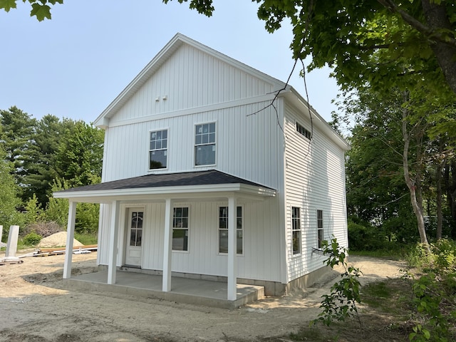 11 Spring St, Lisbon, ME 04250 - view of front of property featuring a porch and board and batten siding