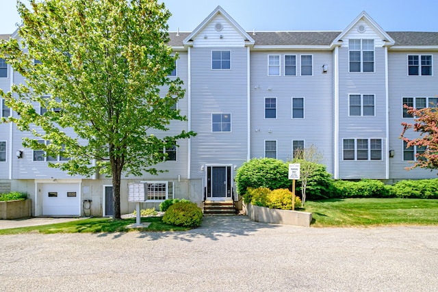 170 E Grand Ave Unit 1, Old Orchard Beach, ME 04064 - view of building exterior featuring an attached garage