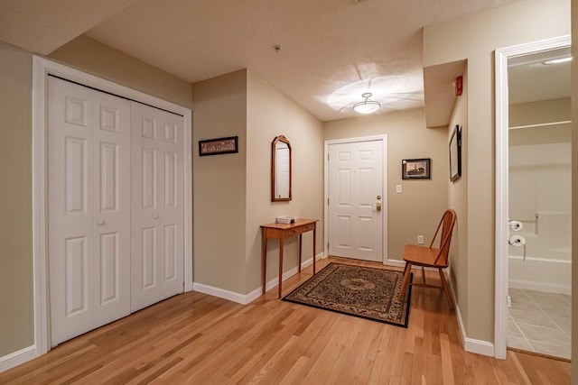 170 E Grand Ave Unit 1, Old Orchard Beach, ME 04064 - foyer with light wood-style floors and baseboards