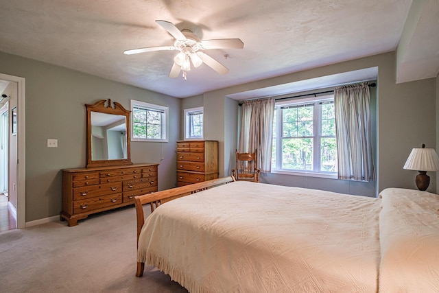170 E Grand Ave Unit 1, Old Orchard Beach, ME 04064 - bedroom featuring light colored carpet, ceiling fan, and baseboards