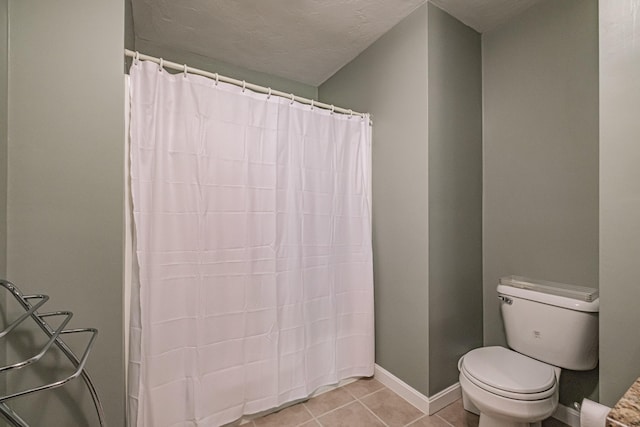 170 E Grand Ave Unit 1, Old Orchard Beach, ME 04064 - full bath featuring toilet, tile patterned flooring, curtained shower, baseboards, and a textured ceiling