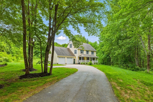 8 Rileys Run, Berwick, ME 03901 - colonial house featuring an attached garage, a front yard, asphalt driveway, and a porch