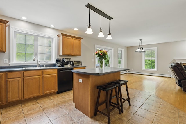 8 Rileys Run, Berwick, ME 03901 - kitchen featuring black dishwasher, a sink, baseboard heating, brown cabinetry, and a kitchen island