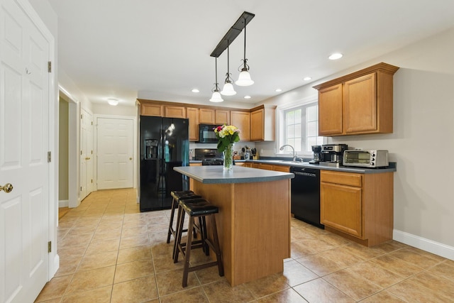8 Rileys Run, Berwick, ME 03901 - kitchen with black appliances, dark countertops, a center island, a breakfast bar area, and recessed lighting