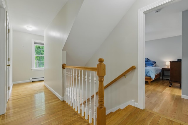 8 Rileys Run, Berwick, ME 03901 - staircase with a baseboard heating unit, hardwood / wood-style floors, and baseboards