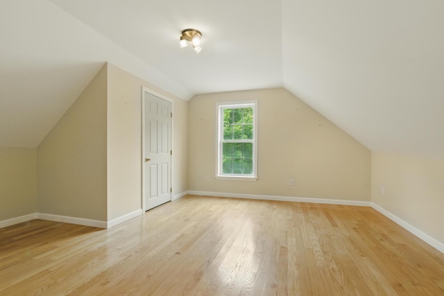 8 Rileys Run, Berwick, ME 03901 - additional living space with lofted ceiling, light wood finished floors, and baseboards