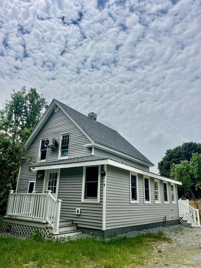 6 Hidden Ave, Livermore Falls, ME 04254 - back of property featuring a shingled roof and a chimney