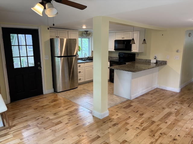 152 Bradman St, Auburn, ME 04210 - kitchen with black appliances, light wood finished floors, white cabinets, a peninsula, and ceiling fan