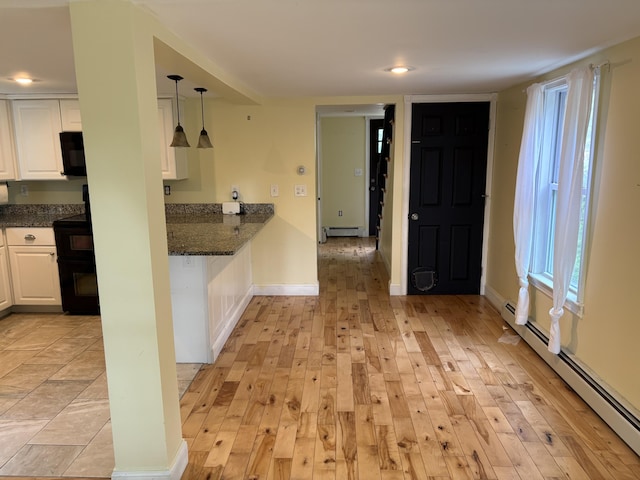 152 Bradman St, Auburn, ME 04210 - kitchen featuring a baseboard heating unit, black appliances, white cabinets, light wood-type flooring, and recessed lighting