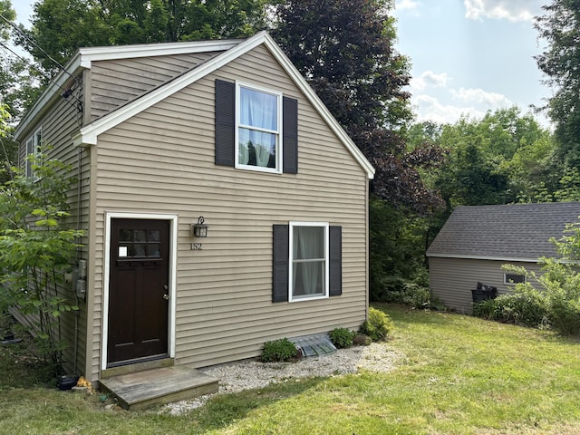 152 Bradman St, Auburn, ME 04210 - rear view of property with a lawn