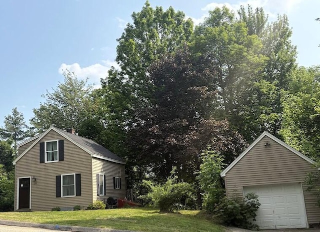 152 Bradman St, Auburn, ME 04210 - view of side of home featuring a garage and a yard