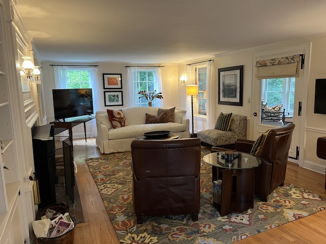 2 Lookout Point Rd, Bar Harbor, ME 04609 - living room featuring wood finished floors, ornamental molding, and a chandelier