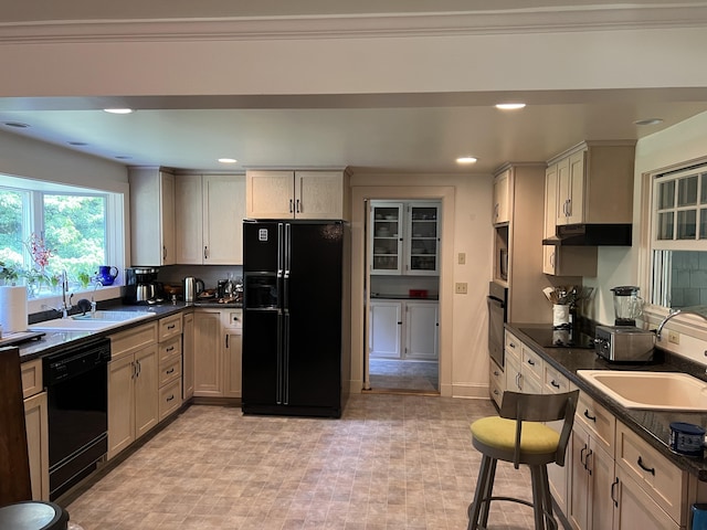 2 Lookout Point Rd, Bar Harbor, ME 04609 - kitchen with black appliances, dark countertops, under cabinet range hood, and recessed lighting