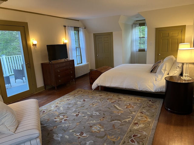 2 Lookout Point Rd, Bar Harbor, ME 04609 - bedroom with radiator, hardwood / wood-style floors, access to outside, multiple windows, and lofted ceiling