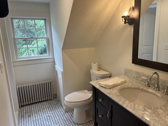 2 Lookout Point Rd, Bar Harbor, ME 04609 - bathroom with radiator, vanity, and tile patterned floors