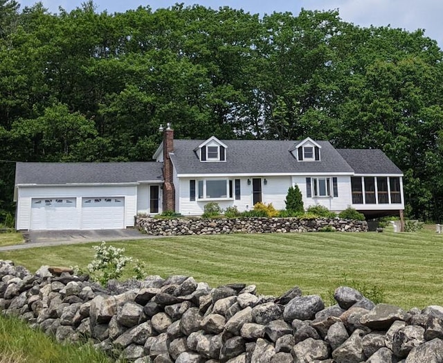 630 Youngs Ridge Rd, Acton, ME 04001 - view of front of house with an attached garage, a front lawn, a sunroom, driveway, and a chimney