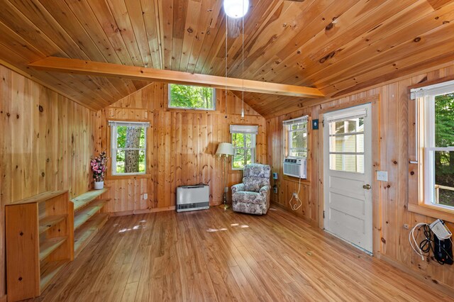 16 Maple Ridge Dr, Monmouth, ME 04259 - living area featuring light wood-style floors, plenty of natural light, cooling unit, heating unit, and wooden walls