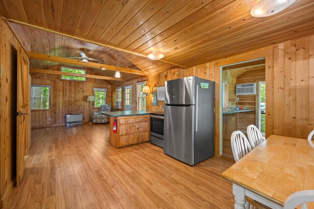16 Maple Ridge Dr, Monmouth, ME 04259 - kitchen with stainless steel appliances, wooden walls, lofted ceiling, wood ceiling, and light wood-type flooring
