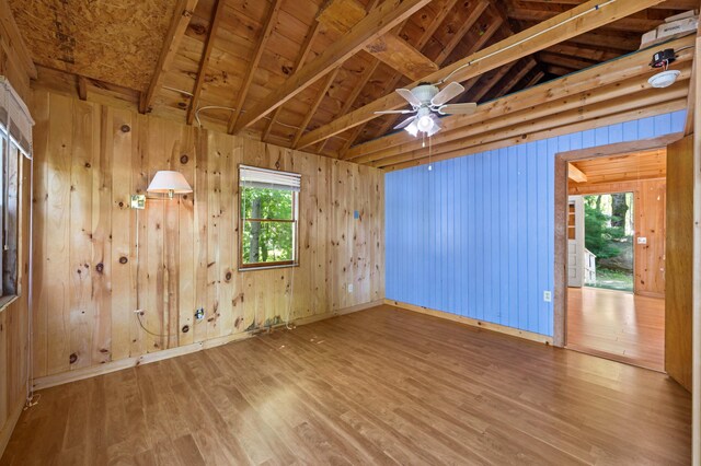 16 Maple Ridge Dr, Monmouth, ME 04259 - spare room with wood finished floors, wood walls, and a ceiling fan