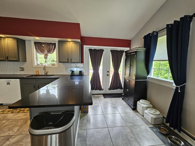 30 Cedar Breeze S, Glenburn, ME 04401 - kitchen featuring dishwasher, dark countertops, a sink, vaulted ceiling, and tasteful backsplash