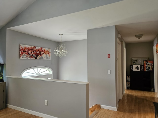 30 Cedar Breeze S, Glenburn, ME 04401 - corridor featuring hardwood / wood-style floors, a chandelier, baseboards, and an upstairs landing