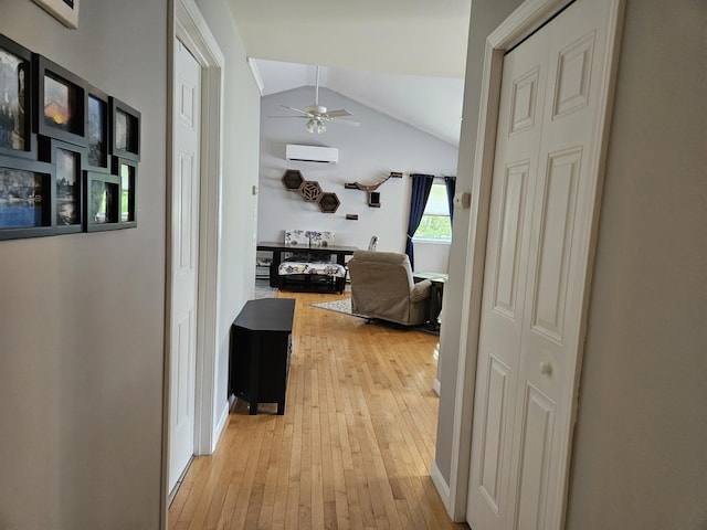 30 Cedar Breeze S, Glenburn, ME 04401 - hallway featuring light wood-style flooring, a wall mounted air conditioner, and vaulted ceiling