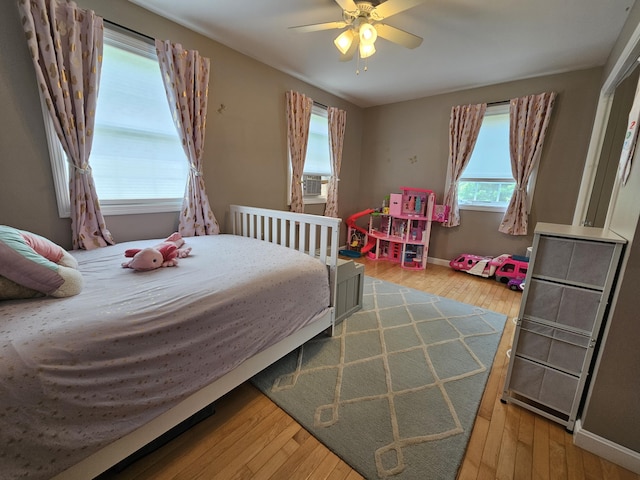 30 Cedar Breeze S, Glenburn, ME 04401 - bedroom with hardwood / wood-style flooring, baseboards, ceiling fan, and cooling unit