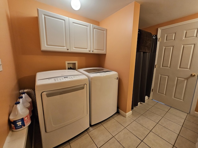 30 Cedar Breeze S, Glenburn, ME 04401 - washroom with cabinet space, separate washer and dryer, light tile patterned floors, and baseboards