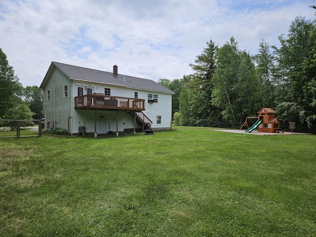 30 Cedar Breeze S, Glenburn, ME 04401 - back of property featuring a wooden deck, a playground, a chimney, and stairs