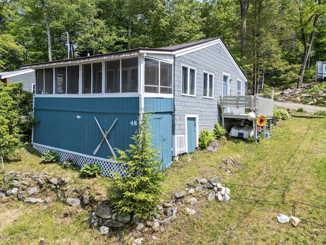 48 E Shore Dr, Greene, ME 04236 - view of side of property with a sunroom and a wooden deck