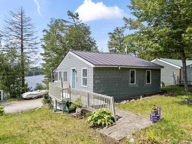 48 E Shore Dr, Greene, ME 04236 - view of front facade featuring a front lawn and metal roof
