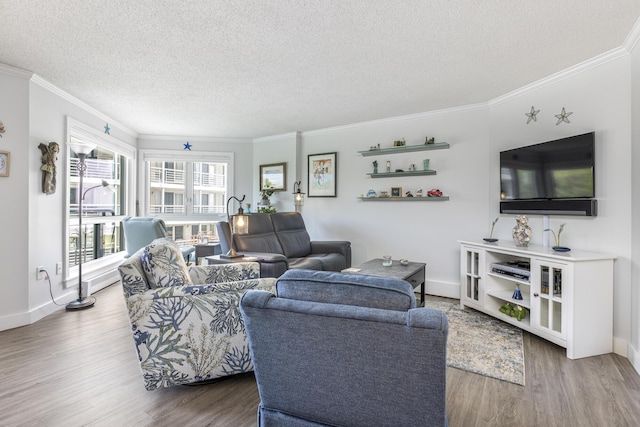 219 E Grand Ave Unit 3C, Old Orchard Beach, ME 04064 - living room featuring a textured ceiling, wood finished floors, and crown molding