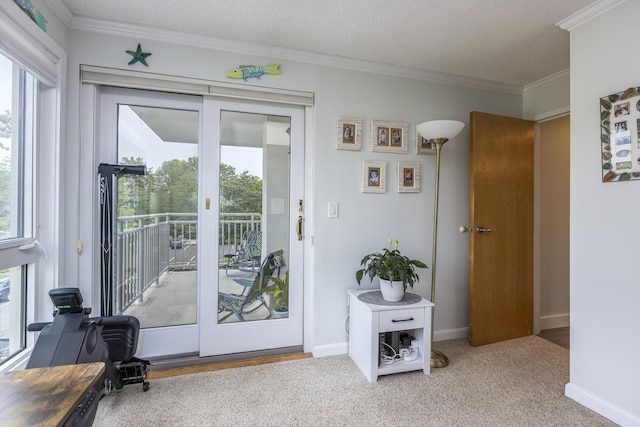 219 E Grand Ave Unit 3C, Old Orchard Beach, ME 04064 - doorway to outside featuring ornamental molding, a desk, carpet floors, and a textured ceiling