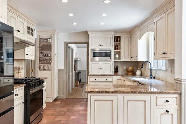 106 Fieldstone Estates Rd, York, ME 03909 - kitchen with cream cabinets, stainless steel microwave, a sink, range with gas cooktop, and recessed lighting