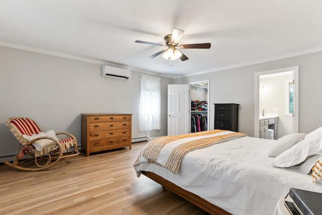 106 Fieldstone Estates Rd, York, ME 03909 - bedroom featuring a wall mounted AC, crown molding, a baseboard radiator, light wood-style flooring, and a closet
