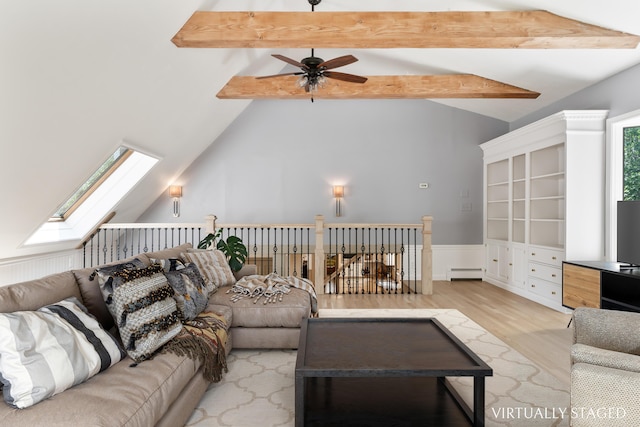 106 Fieldstone Estates Rd, York, ME 03909 - living room with a baseboard heating unit, ceiling fan, wood finished floors, and a skylight
