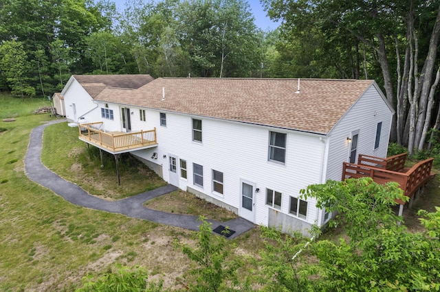 51 Burnham Rd, Saco, ME 04072 - back of property with a wooden deck, roof with shingles, a lawn, and view of scattered trees