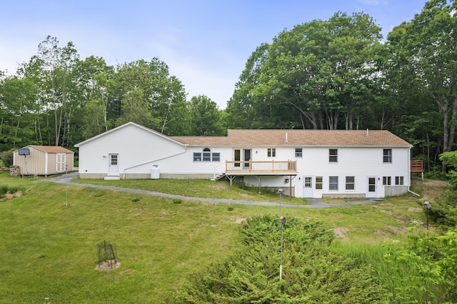 51 Burnham Rd, Saco, ME 04072 - rear view of property featuring a yard, a deck, and view of scattered trees