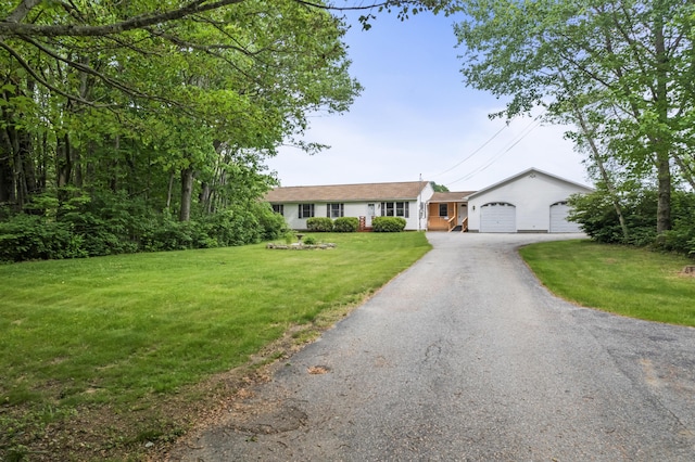 51 Burnham Rd, Saco, ME 04072 - ranch-style house featuring a front lawn, driveway, and an attached garage